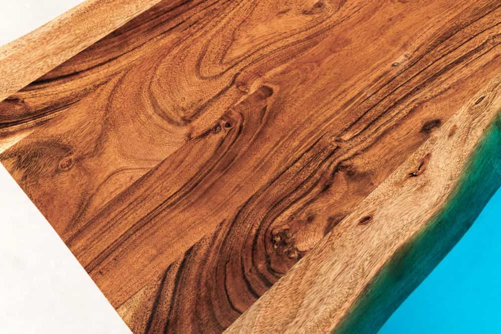 Massiver Esstisch LIQUID 160cm braun Akazienholz Baumkante schwarz Eisen blau