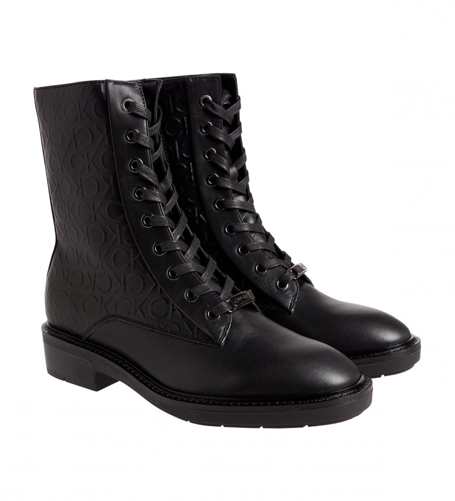 Botas de combate Calvin Klein com sola de borracha, em couro, pretas.