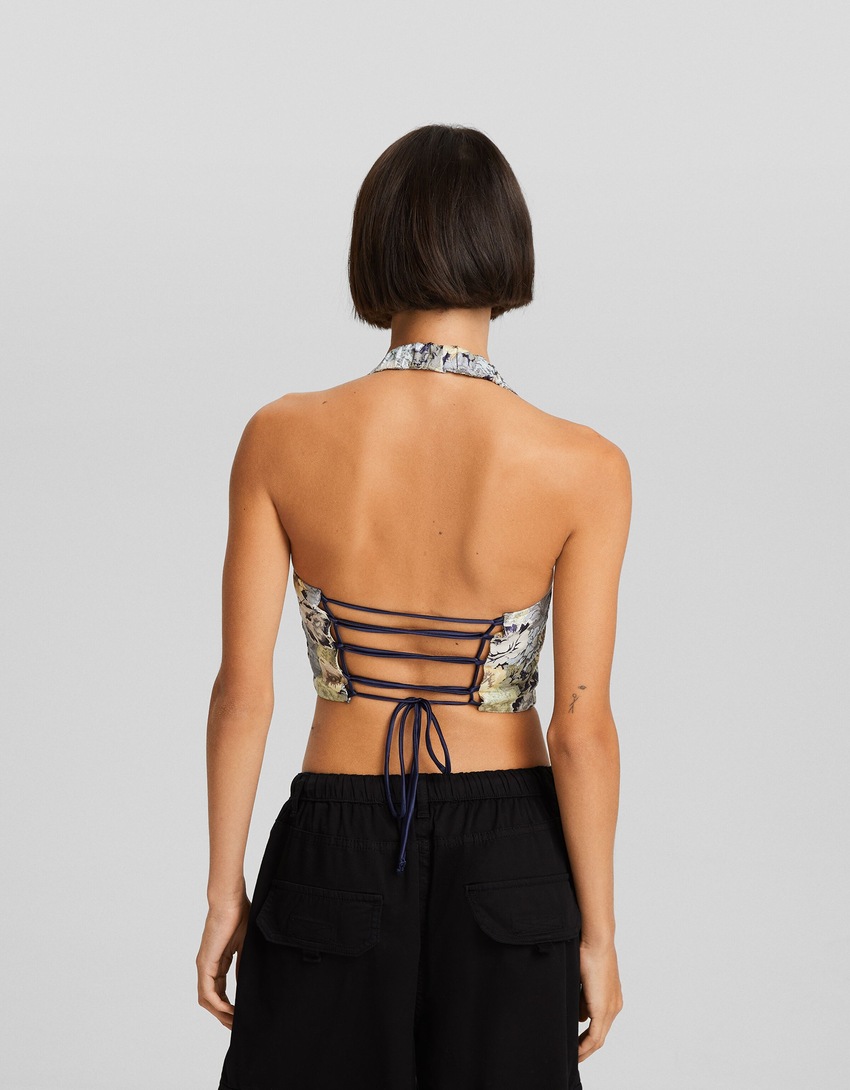 Blusa aberta nas costas com amarração em jacquard