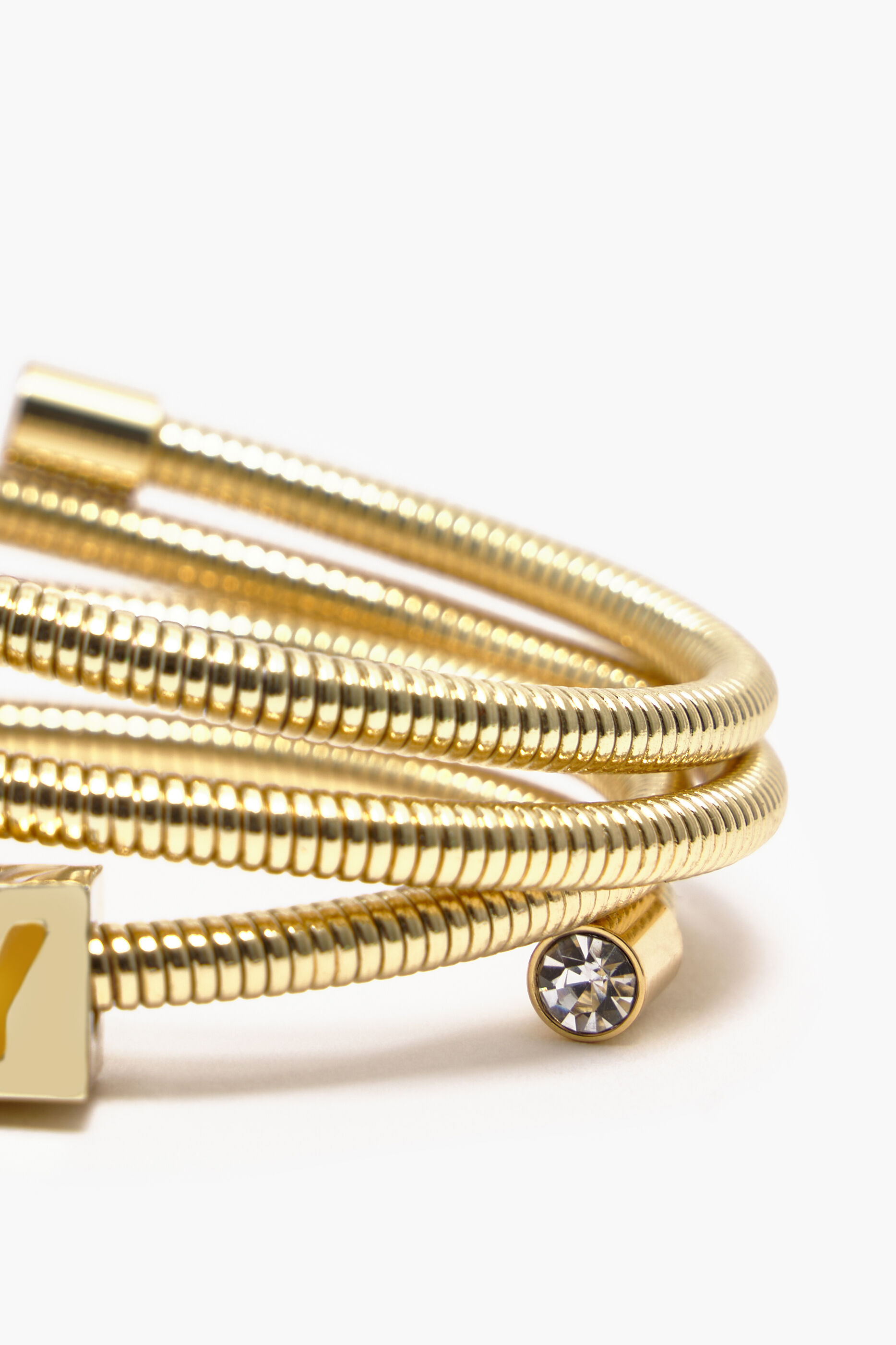 Pulseira de mola com logotipo dourado
