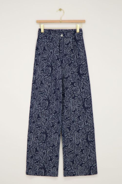 Blauwe denim jeans met rozen