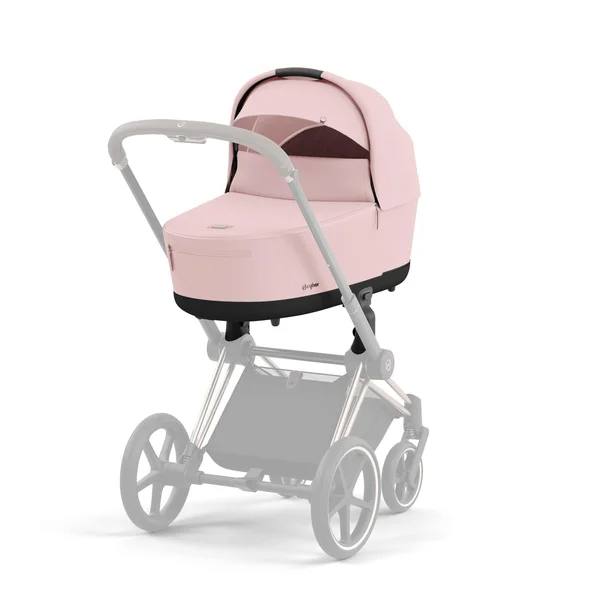 Carrinho de bebê Cybex Priam V4 na cor rosa pêssego com estrutura preta fosca