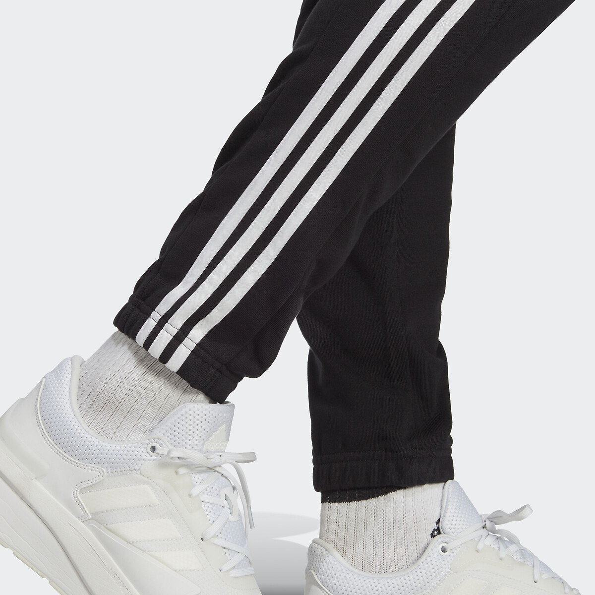 Roupas esportivas Adidas<br>Calças de corrida afuniladas com barra elástica