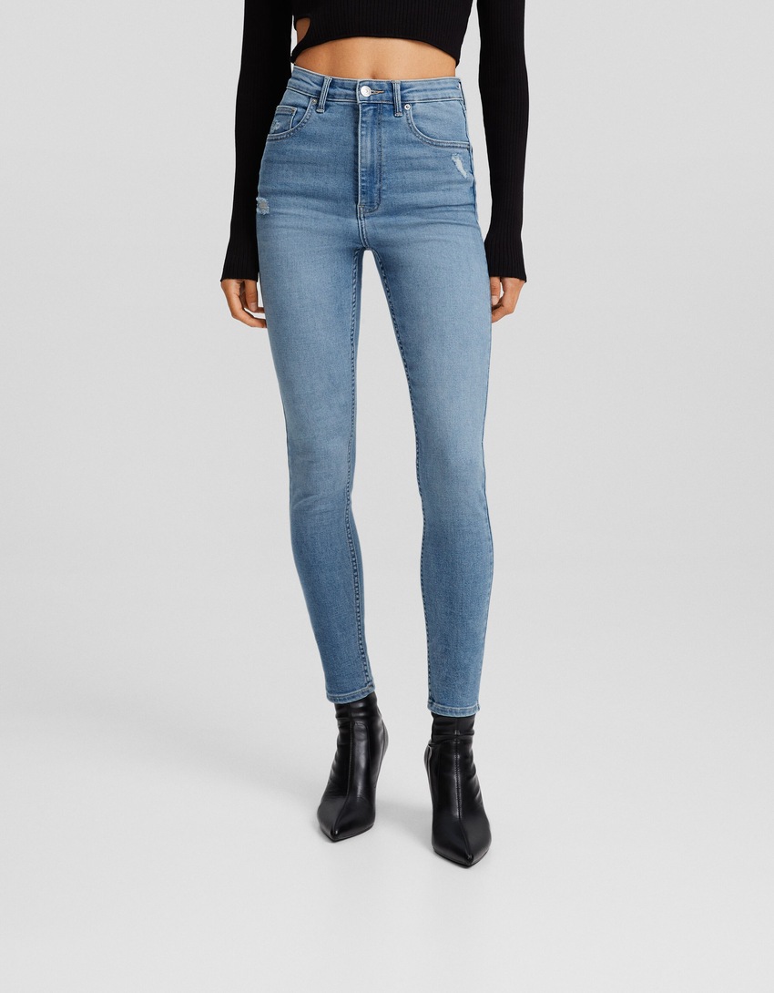 calça jeans skinny de cintura super alta