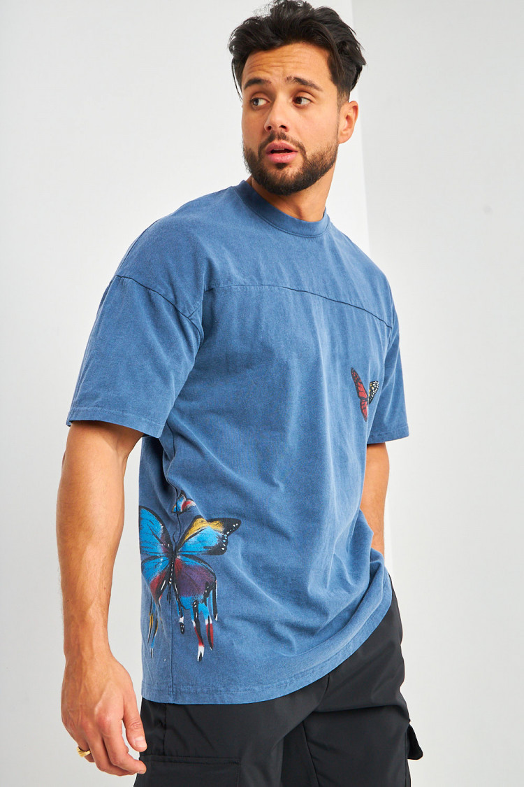 T-shirt bleu à imprimé papillons multicolores