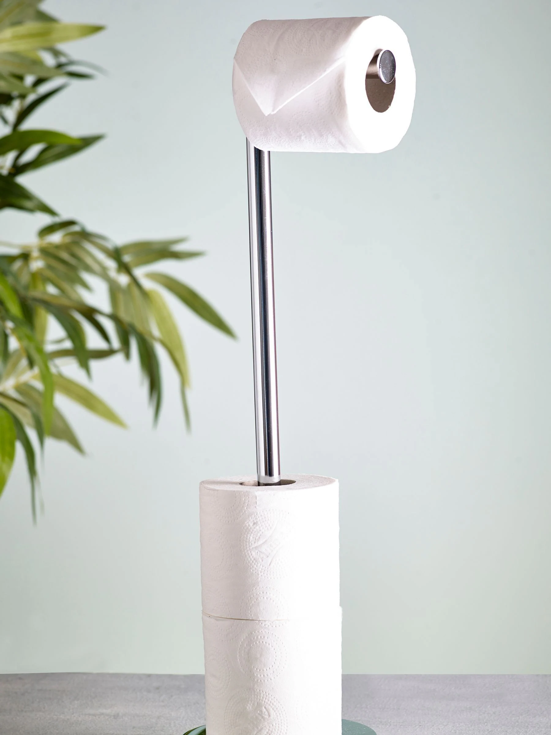 Toiletrolhouder met roterende bovenkant