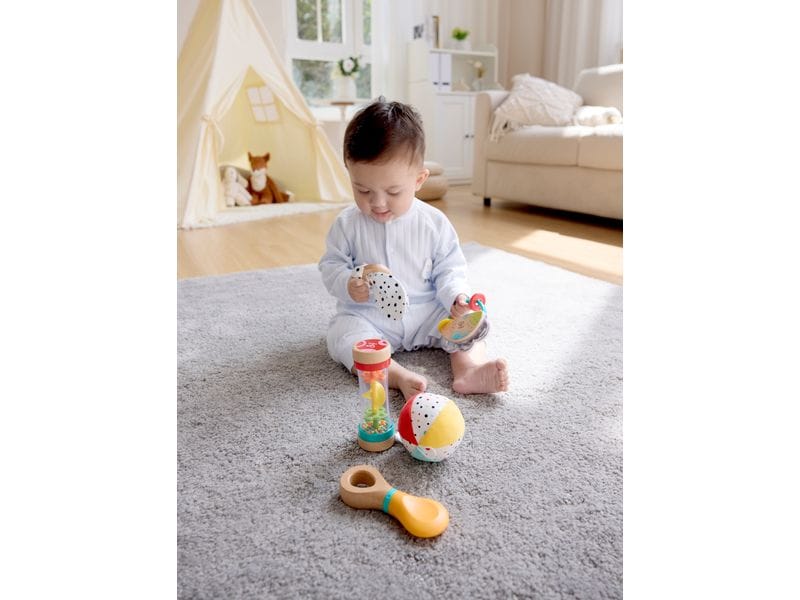 Hape Musikspielzeug 5-in-1-Baby-Sensorik-Set 5-tlg Spielzeugset fördert die sensorische Entwicklung