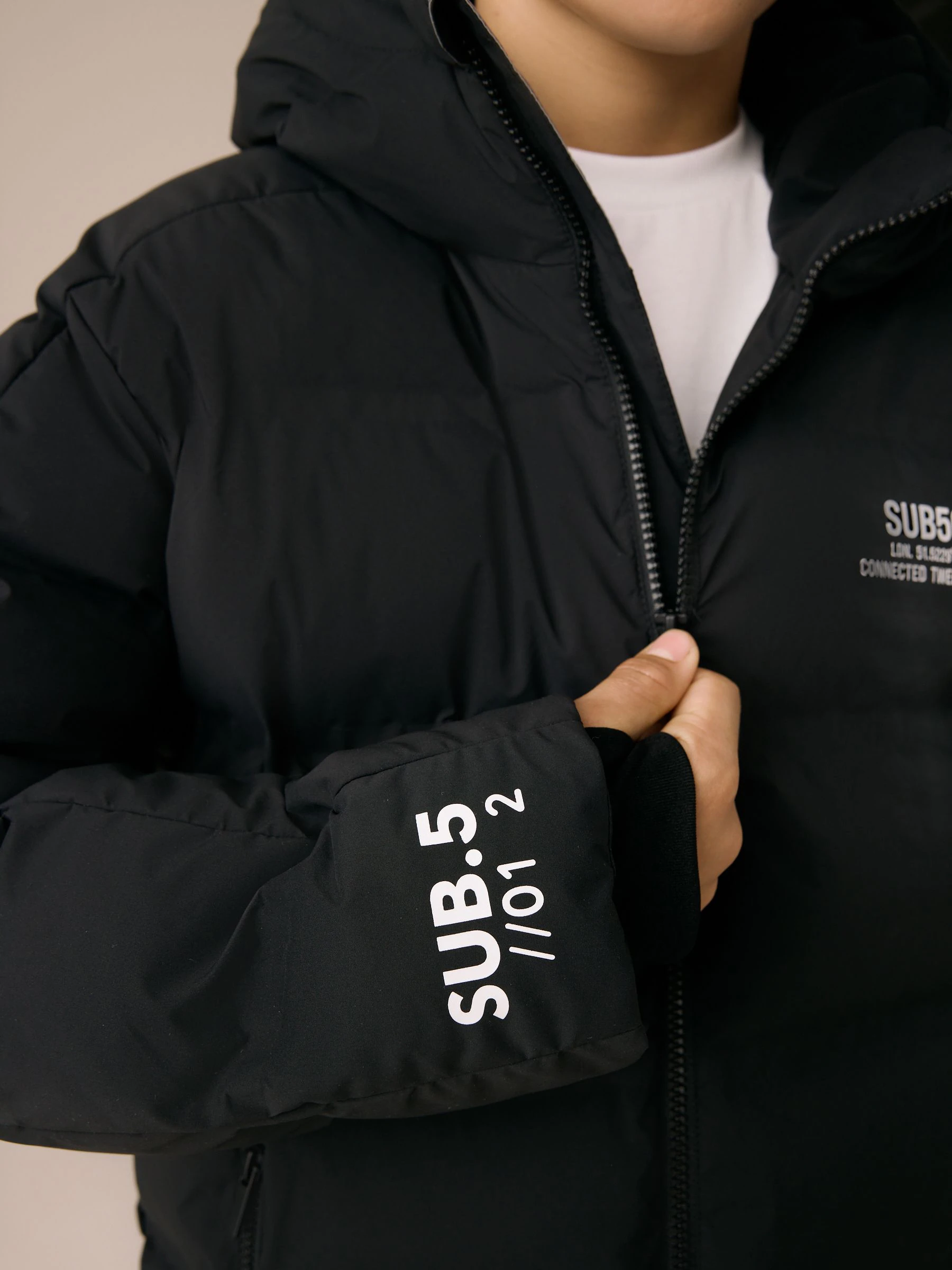 Zwart/wit - Regenbestendige gewatteerde jas met microfleece voering (3-17jr)