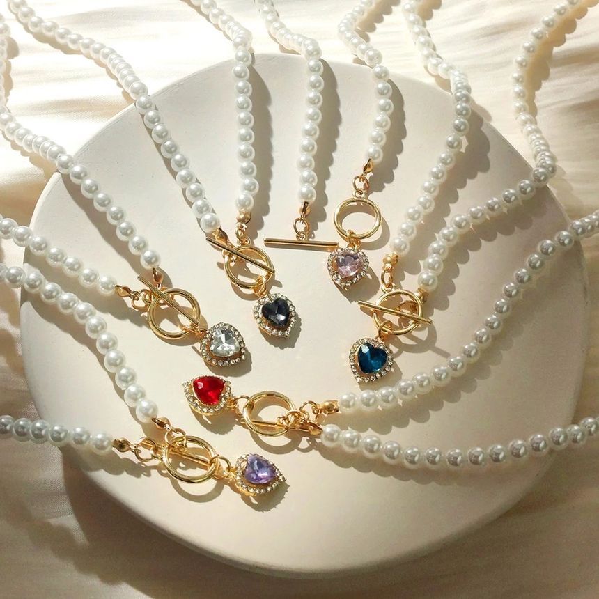 Gemsha - Kunstparelketting met strass-hartjes en hart