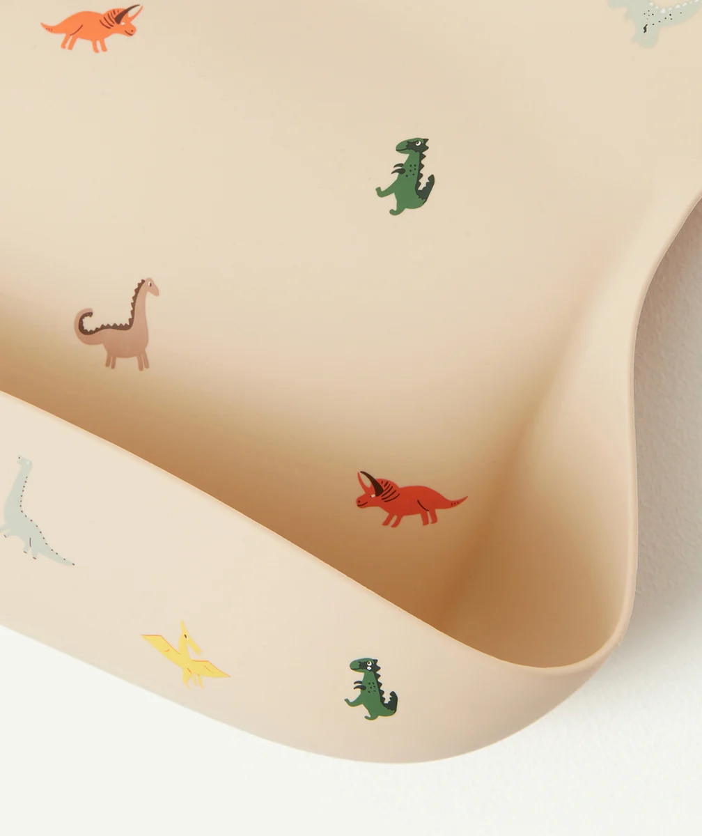 MUSHIEBAVOIR DINOSAURES BEIGE EN SILICONE POUR BÉBÉ