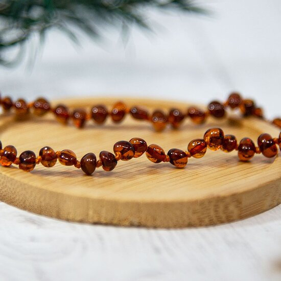 Collier Ambre bébé   Cognac        de               Irréversible