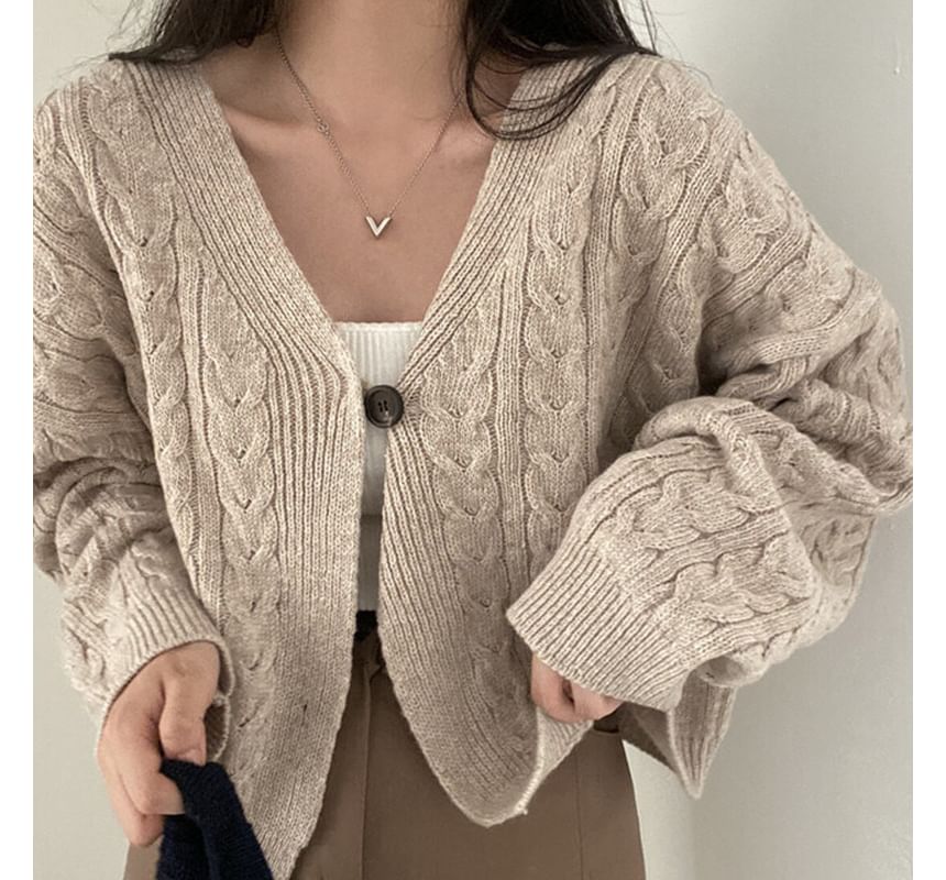 OGAWA - V-hals effen kabelgebreide crop top met één knoop