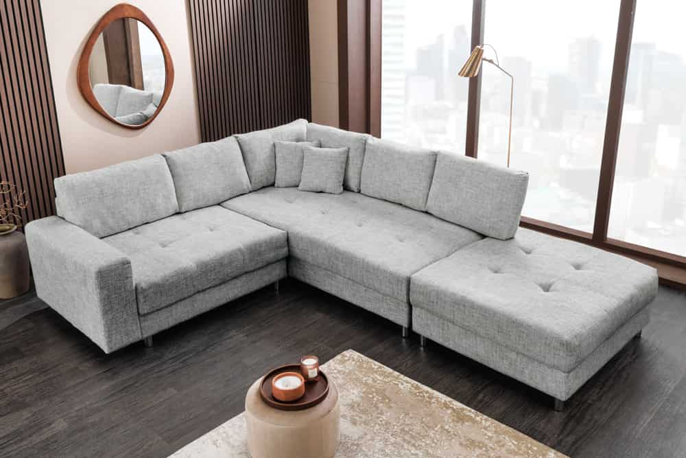 Moderne Wohnlandschaft KENT 220cm grau Strickstoff Ecksofa inkl. Hocker und Kissen