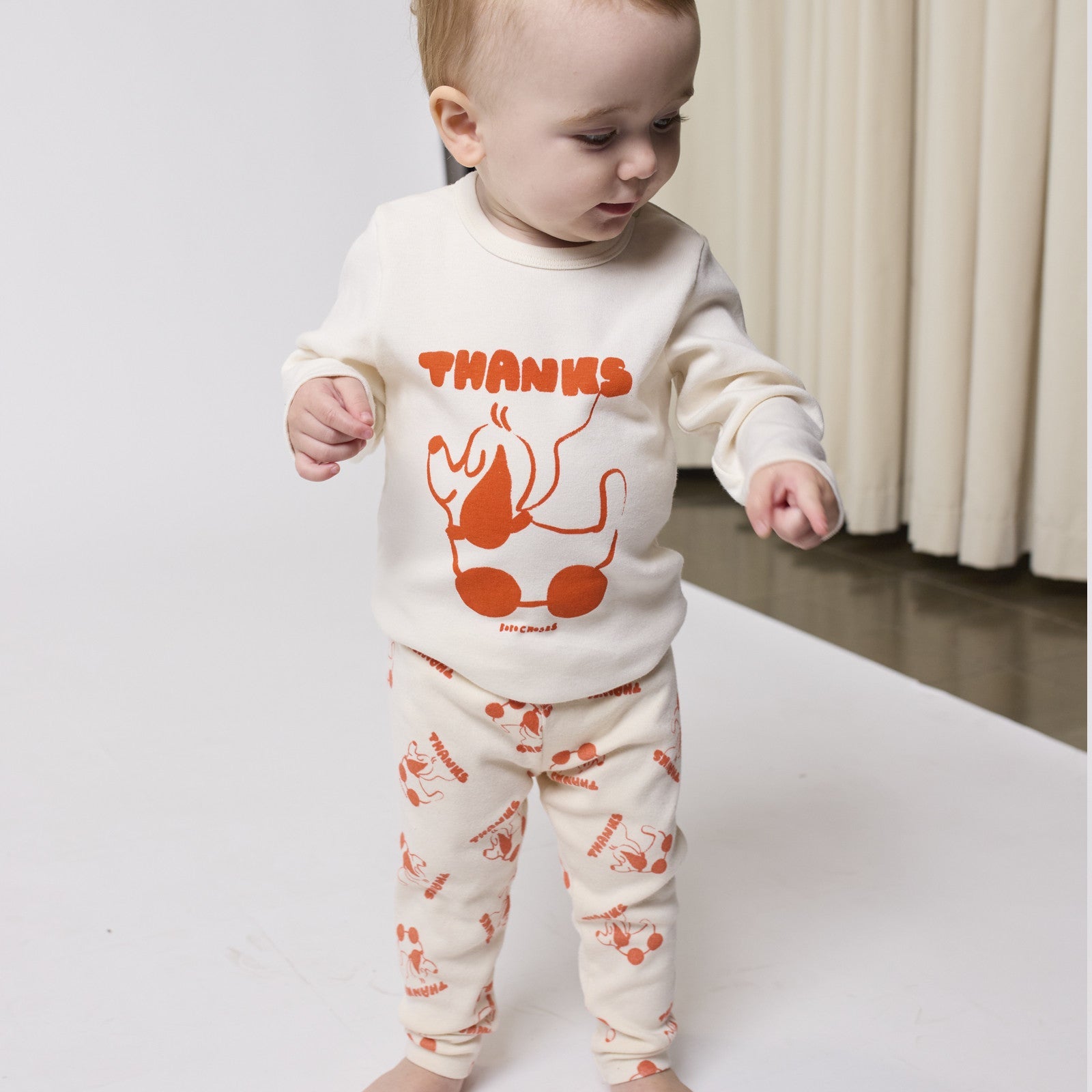 Baby Leggings Rolling Dog Offwhite