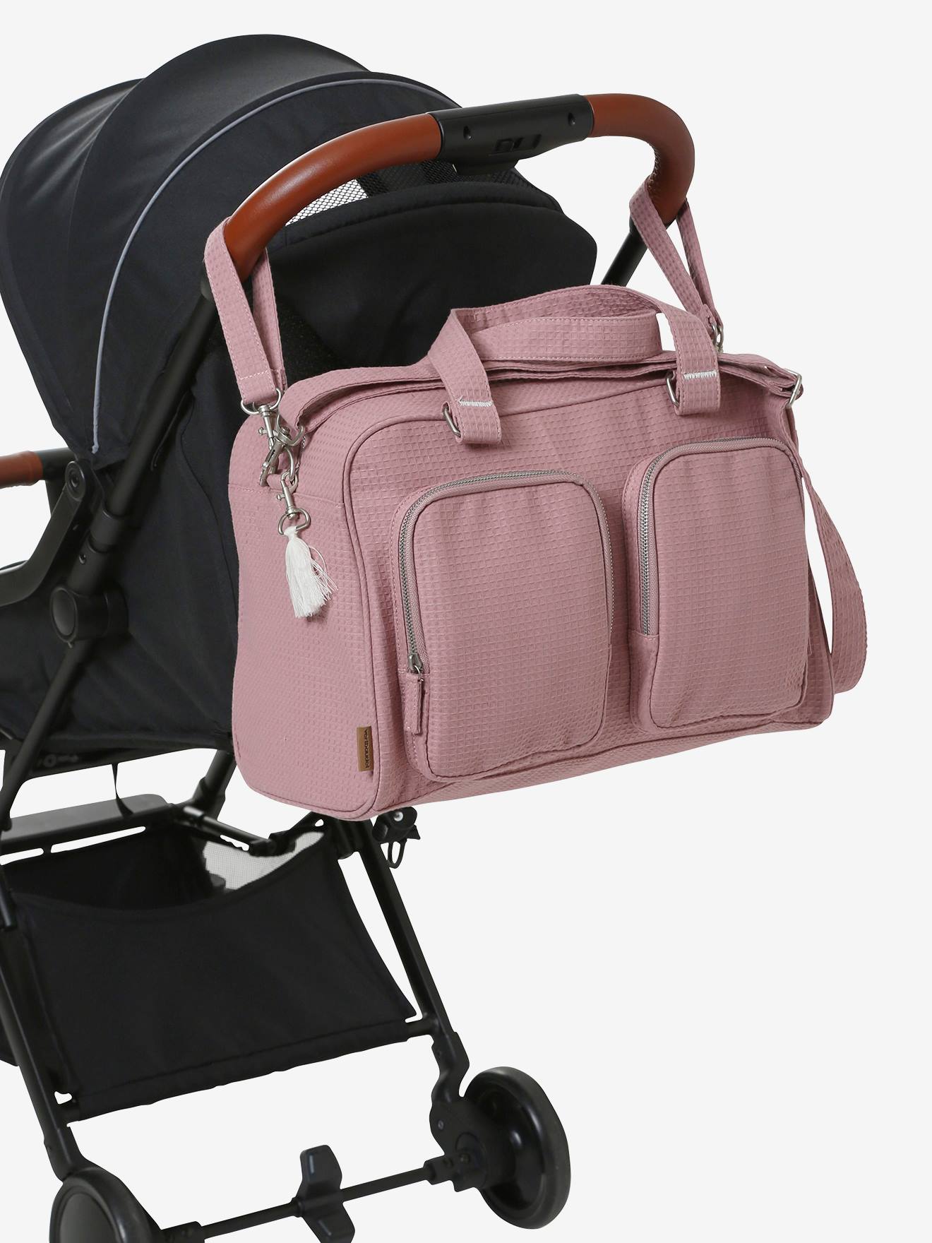 Bolsa de maternidade familiar rosa claro lisa em algodão com padrão favo de mel e vários bolsos.