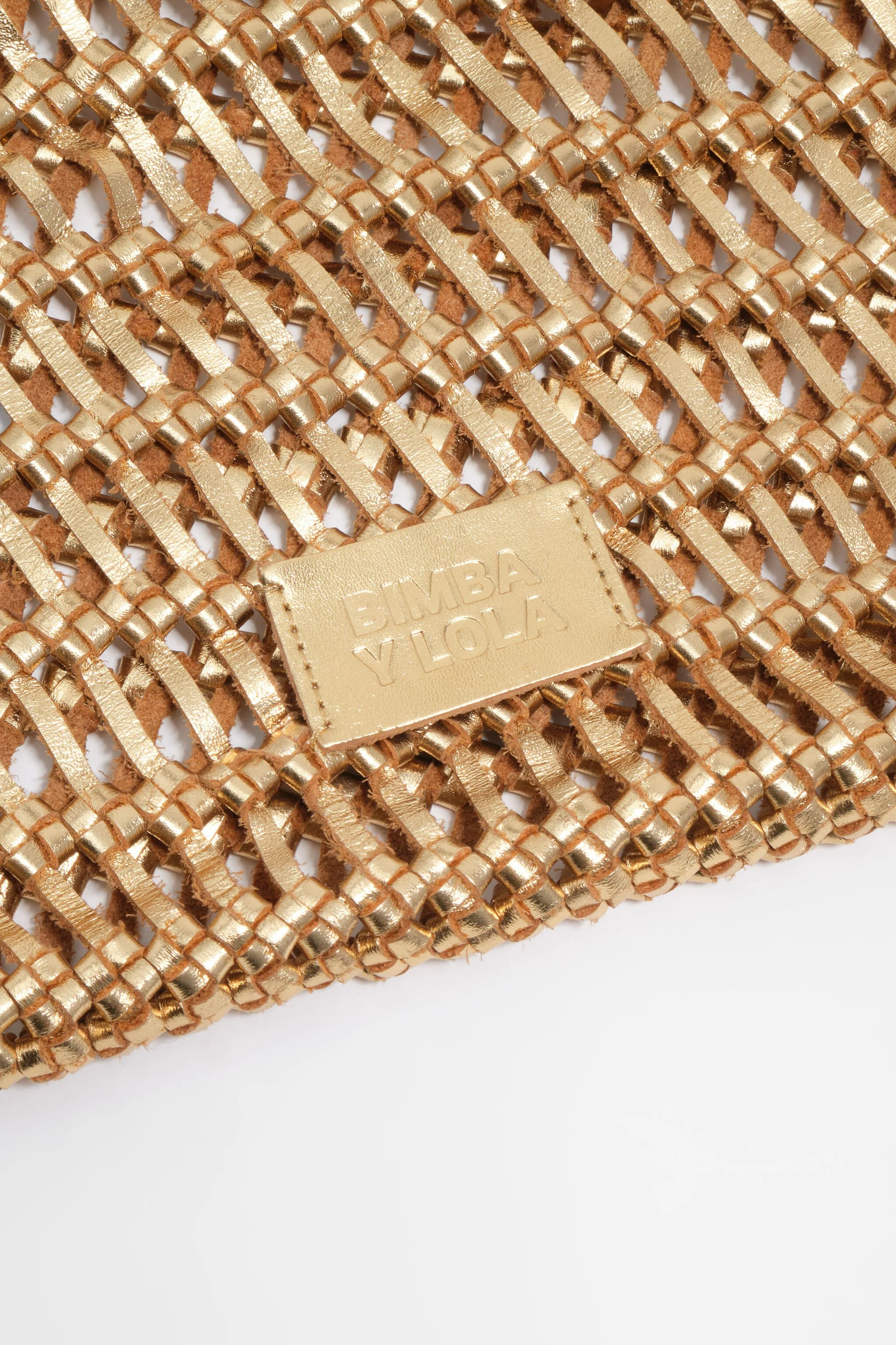 Bolsa de couro trançado dourado