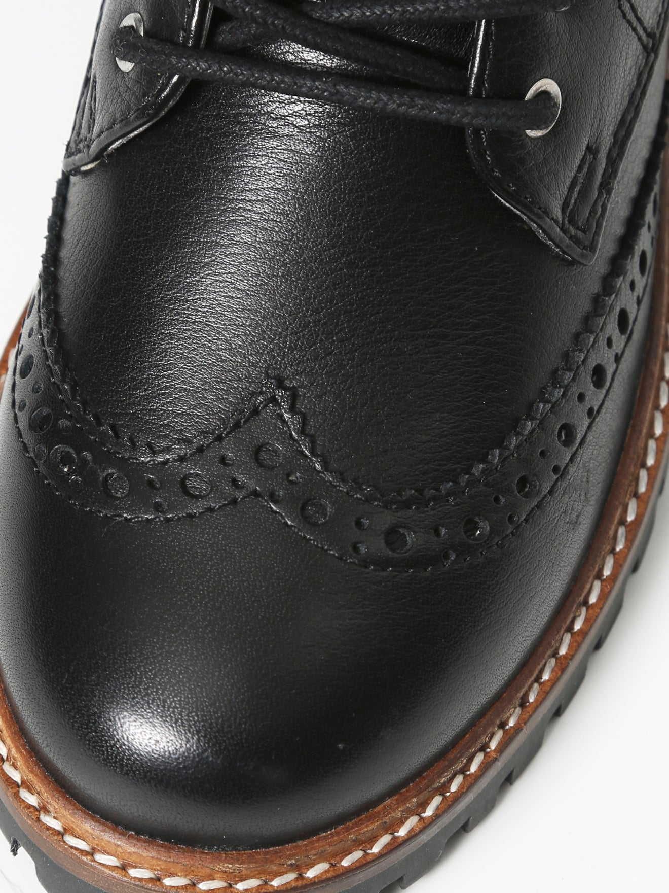 Bottines en cuir bout fleuri Garçon