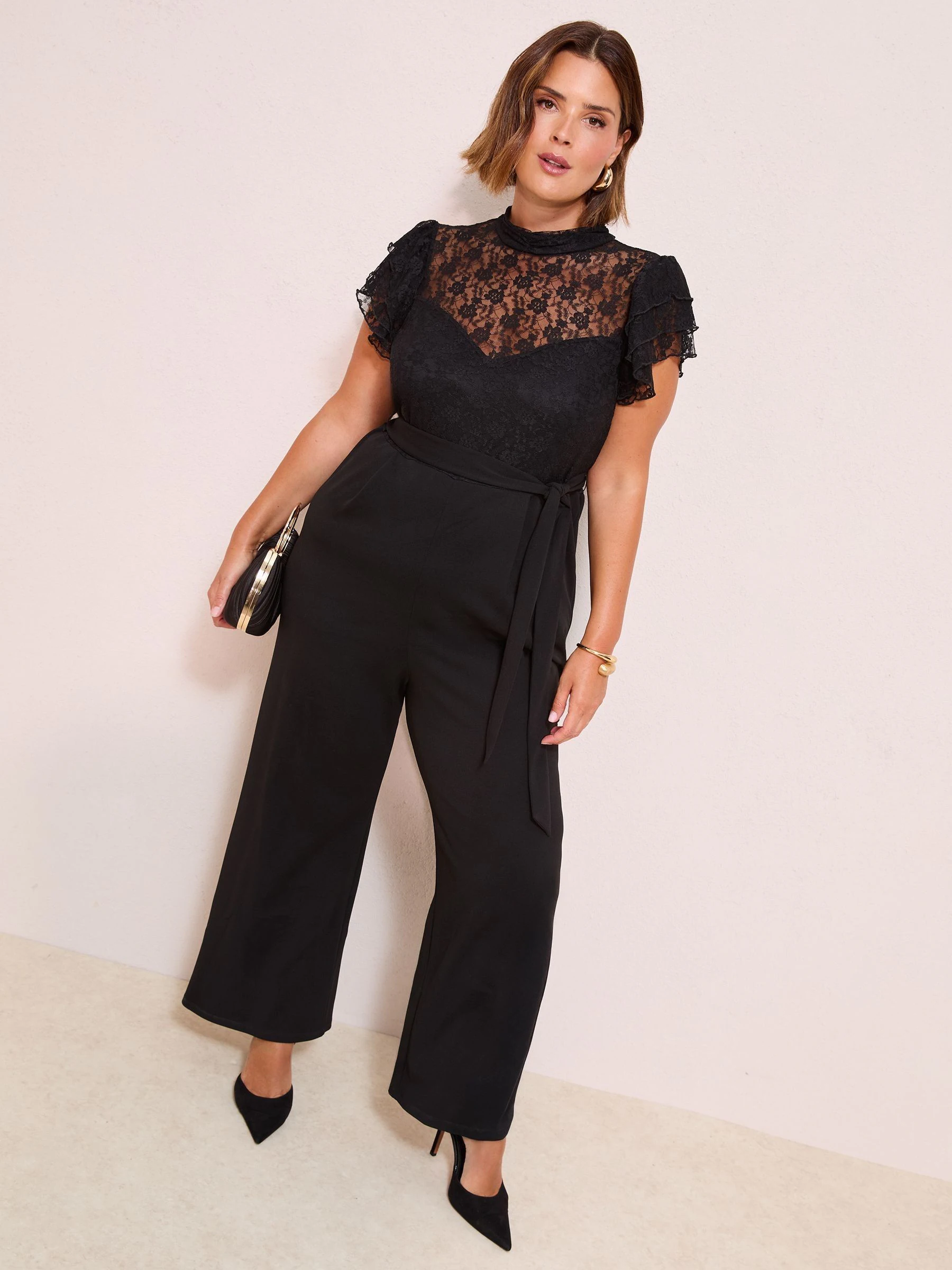 Zwart - Friends Like These jumpsuit van kant en scubamix met ruches aan de mouwen