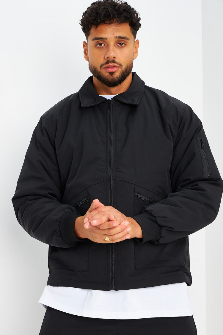 Blouson noir à poches zippées