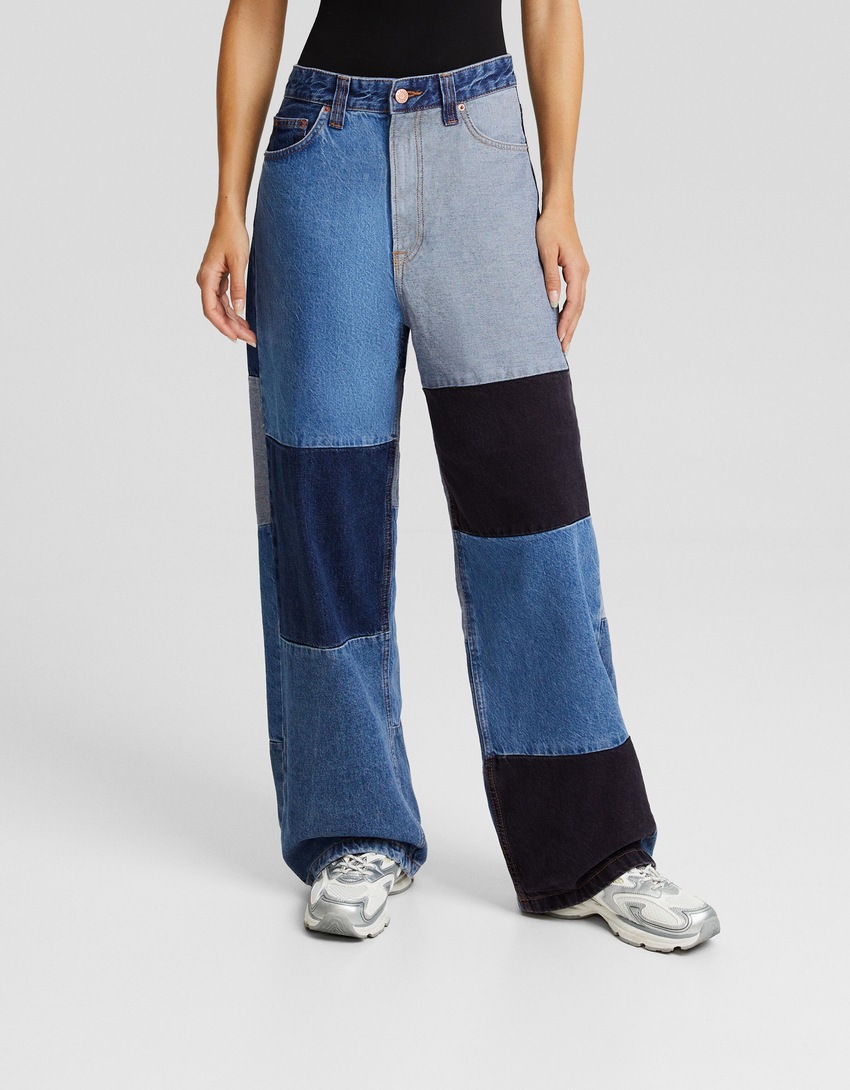 calças jeans super largas com blocos de cores