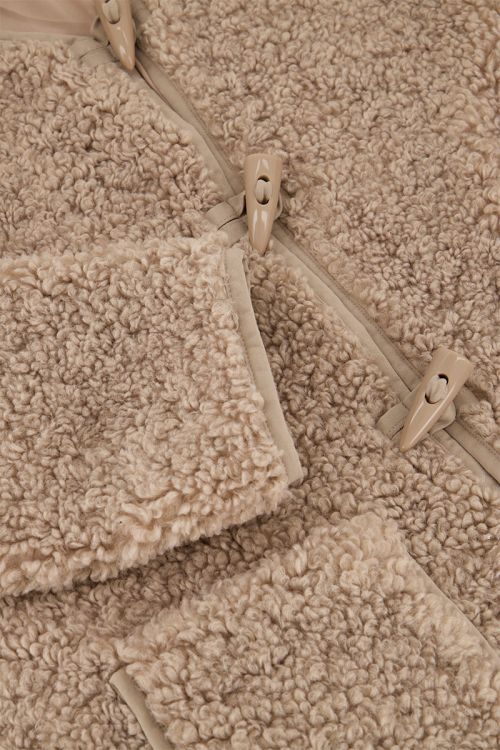 Beige teddy jas met knopen