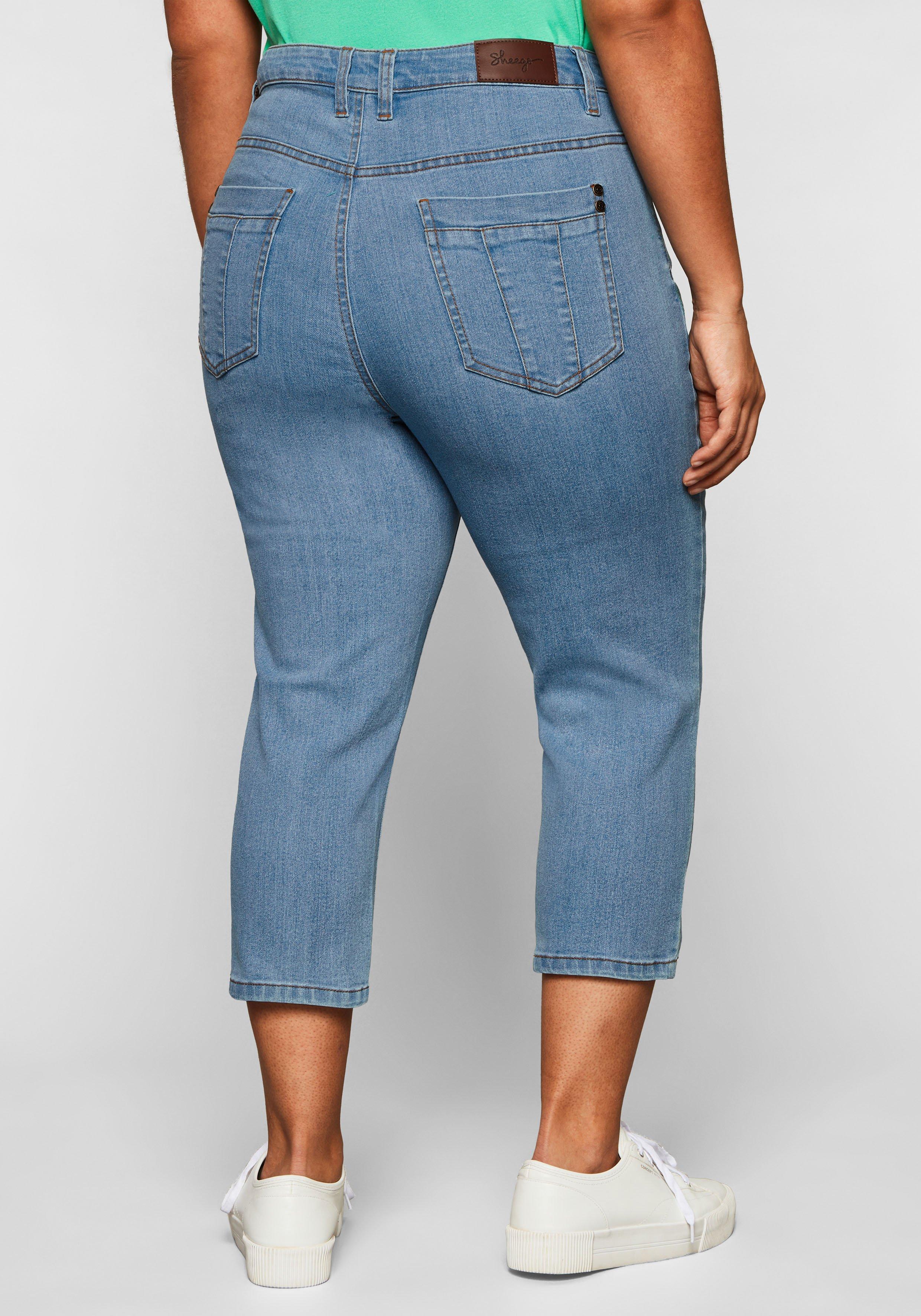 Caprijeans mit Catfaces und Kontrastnähten