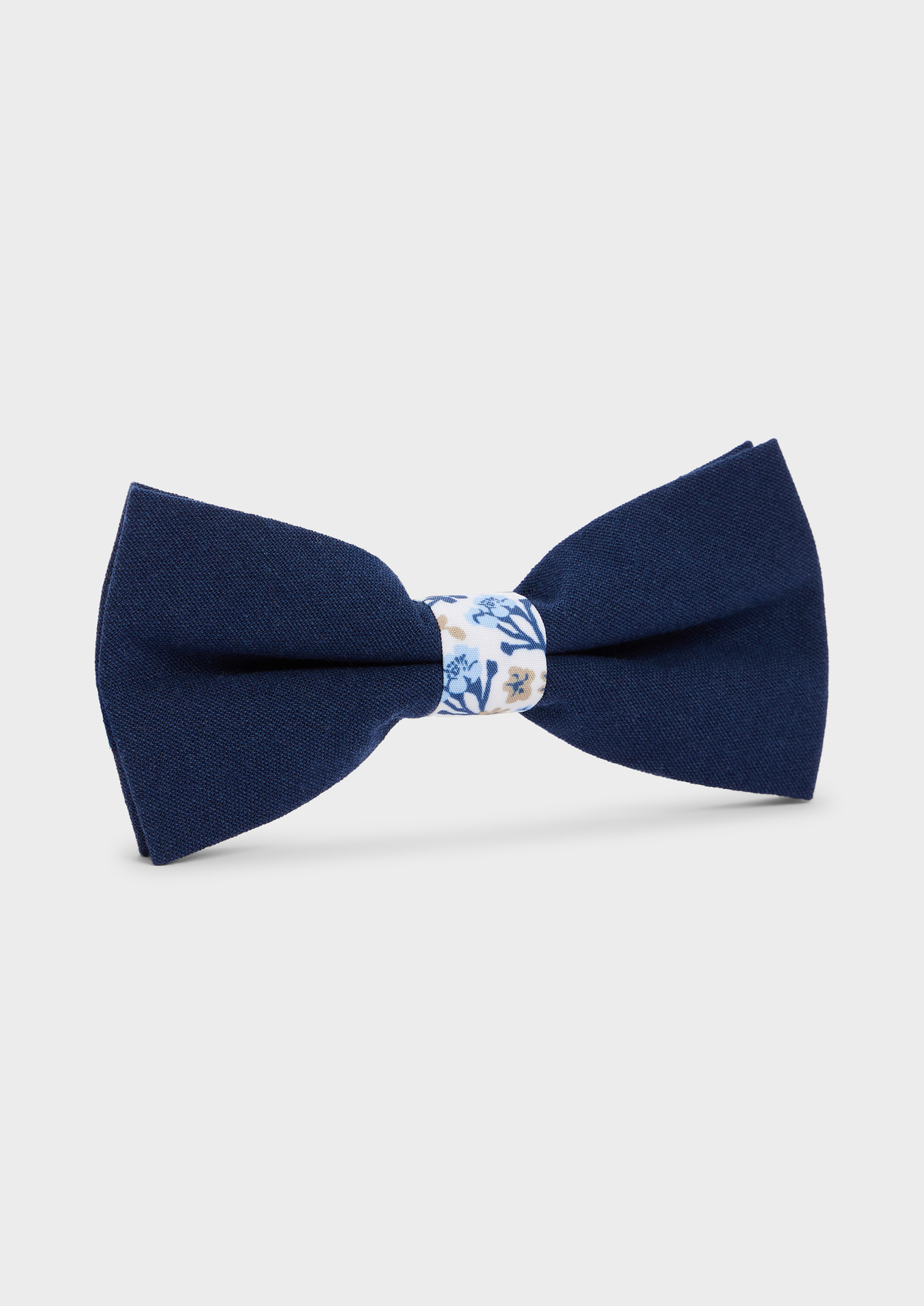 Noeud papillon bi-matière bleu indigo à motif fleuri blanc, bleu et beige