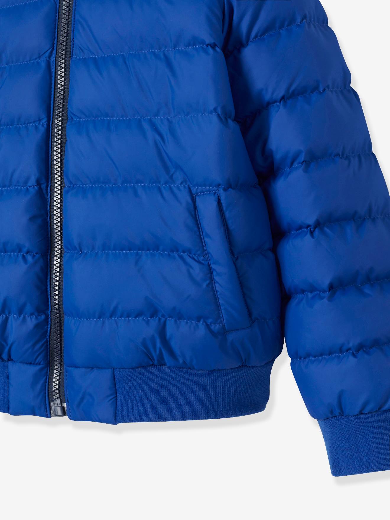 Jaqueta lisa azul-escura reversível para meninos com estampas.