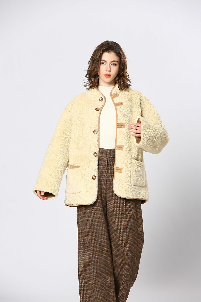 Vejo você em breve<br>Omkeerbare jas em sherpa