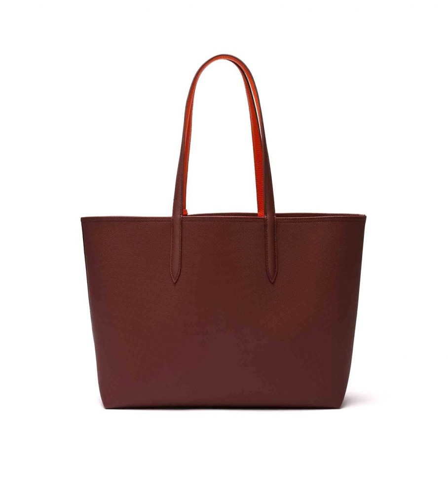 Bolsa Lacoste Anna reversível em dois tons, bordô e vermelha.