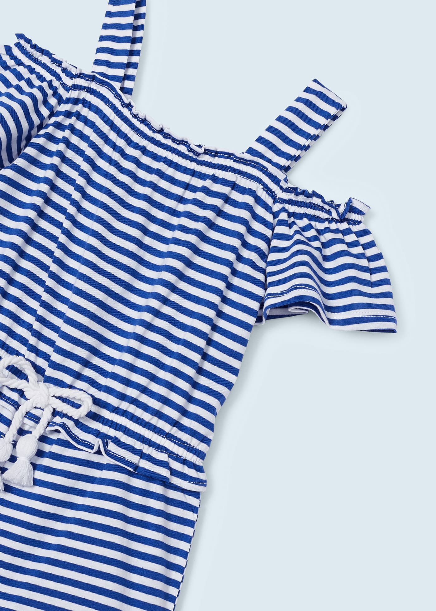 Macacão curto estampado para meninas, feito de algodão sustentável.