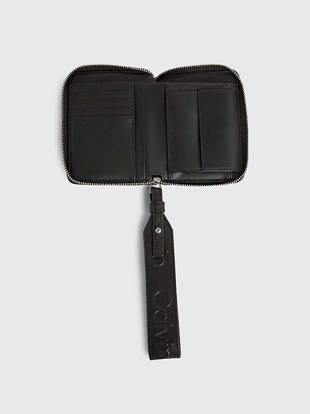 Carteira com zíper completo e porta-moedas de pulso com proteção RFID.