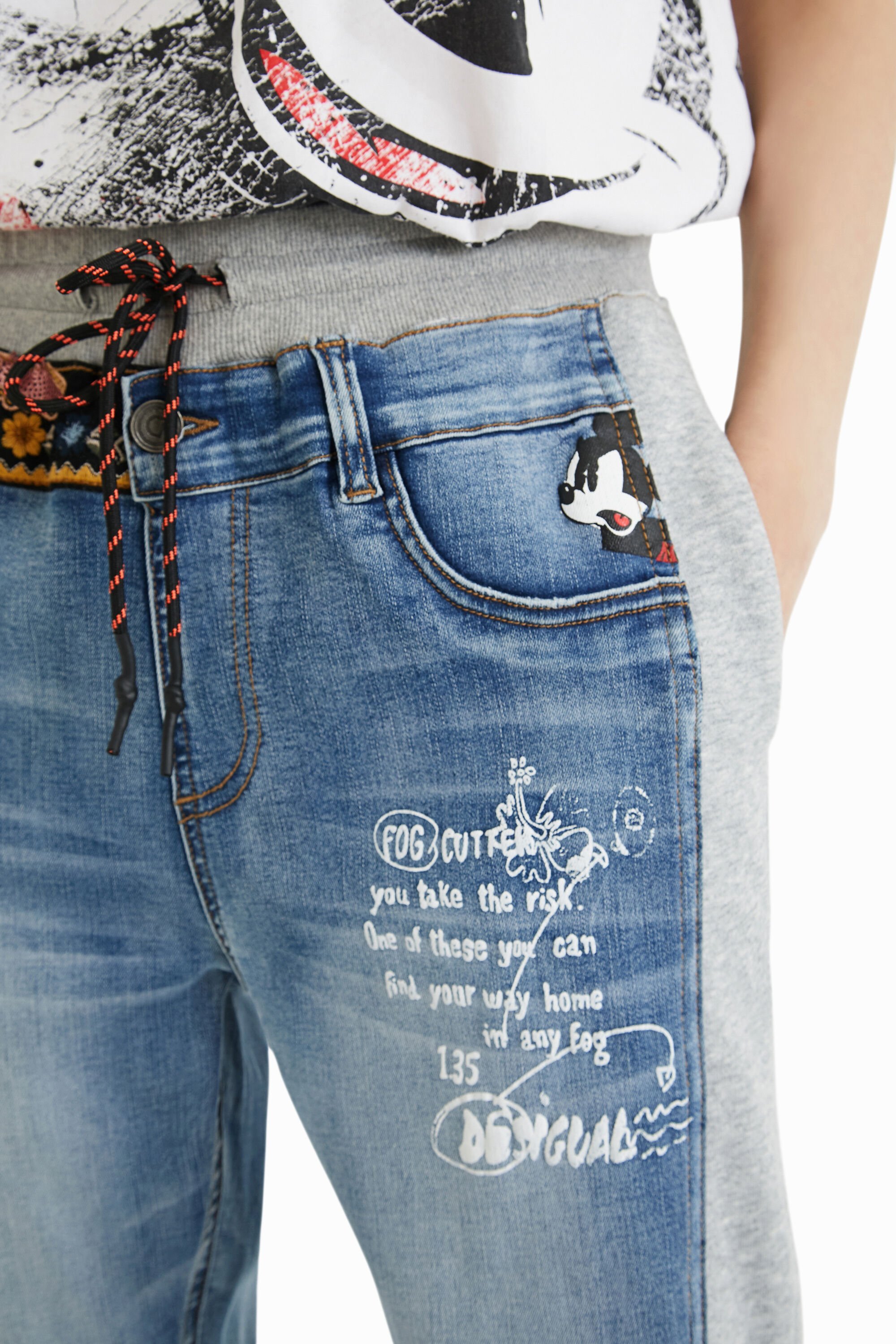 Jean jogging Mickey Mouse