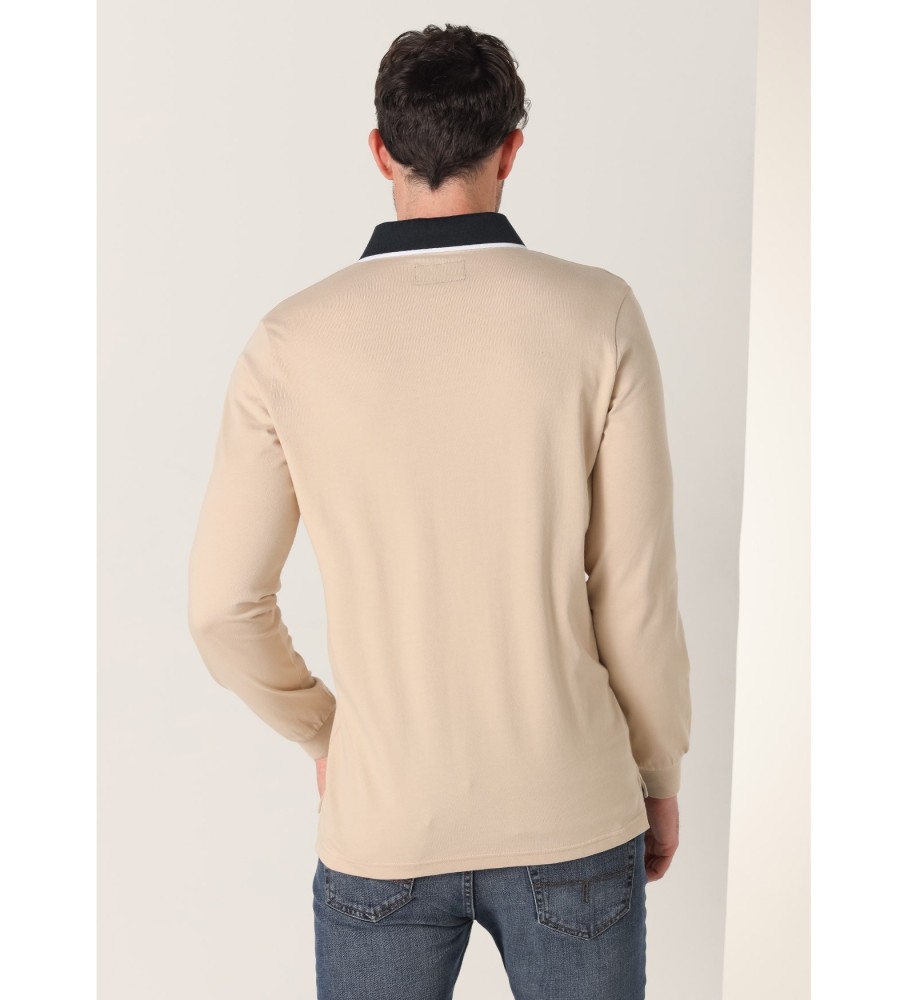 Polo Lois de manga comprida com gola jacquard e duas listras bege.
