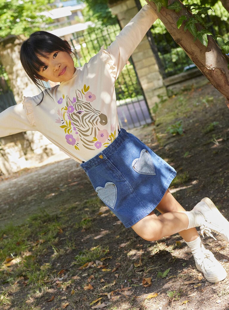 T-shirt rose pâle à motif zèbre pailleté