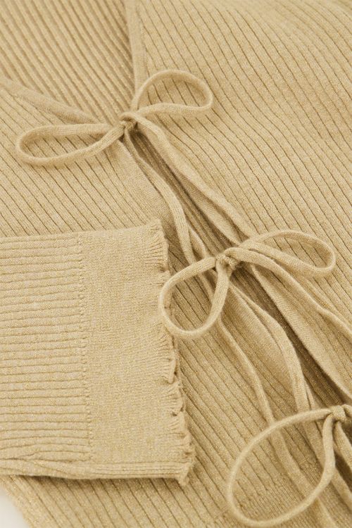 Beige vestje met lurex & strikjes