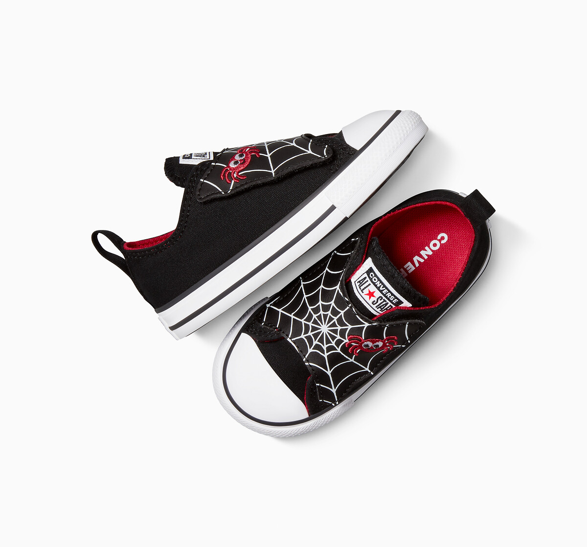 CONVERSE<br>Tênis com uma tira e estampa de teia de aranha
