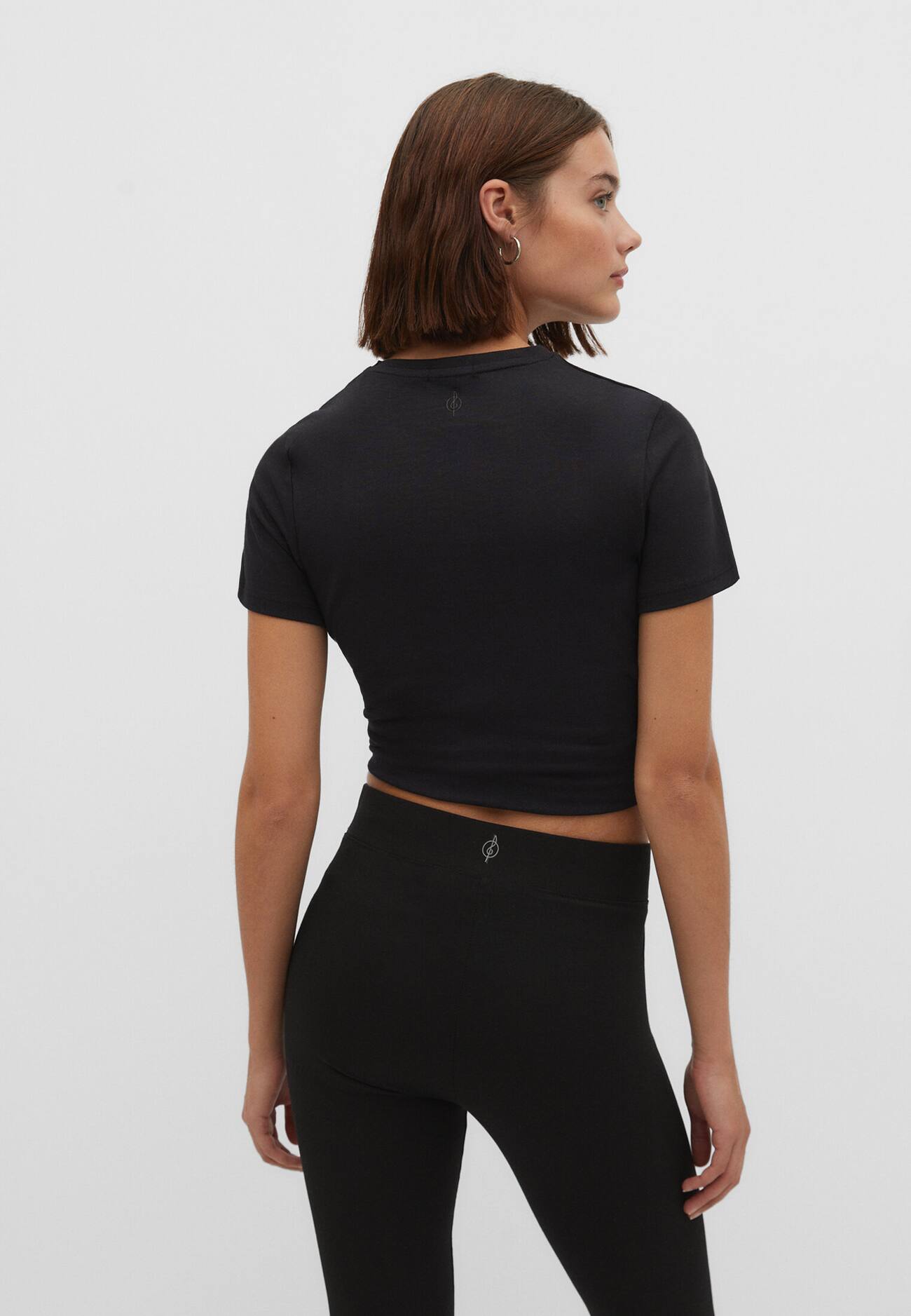 Camiseta de algodão com franzido lateral