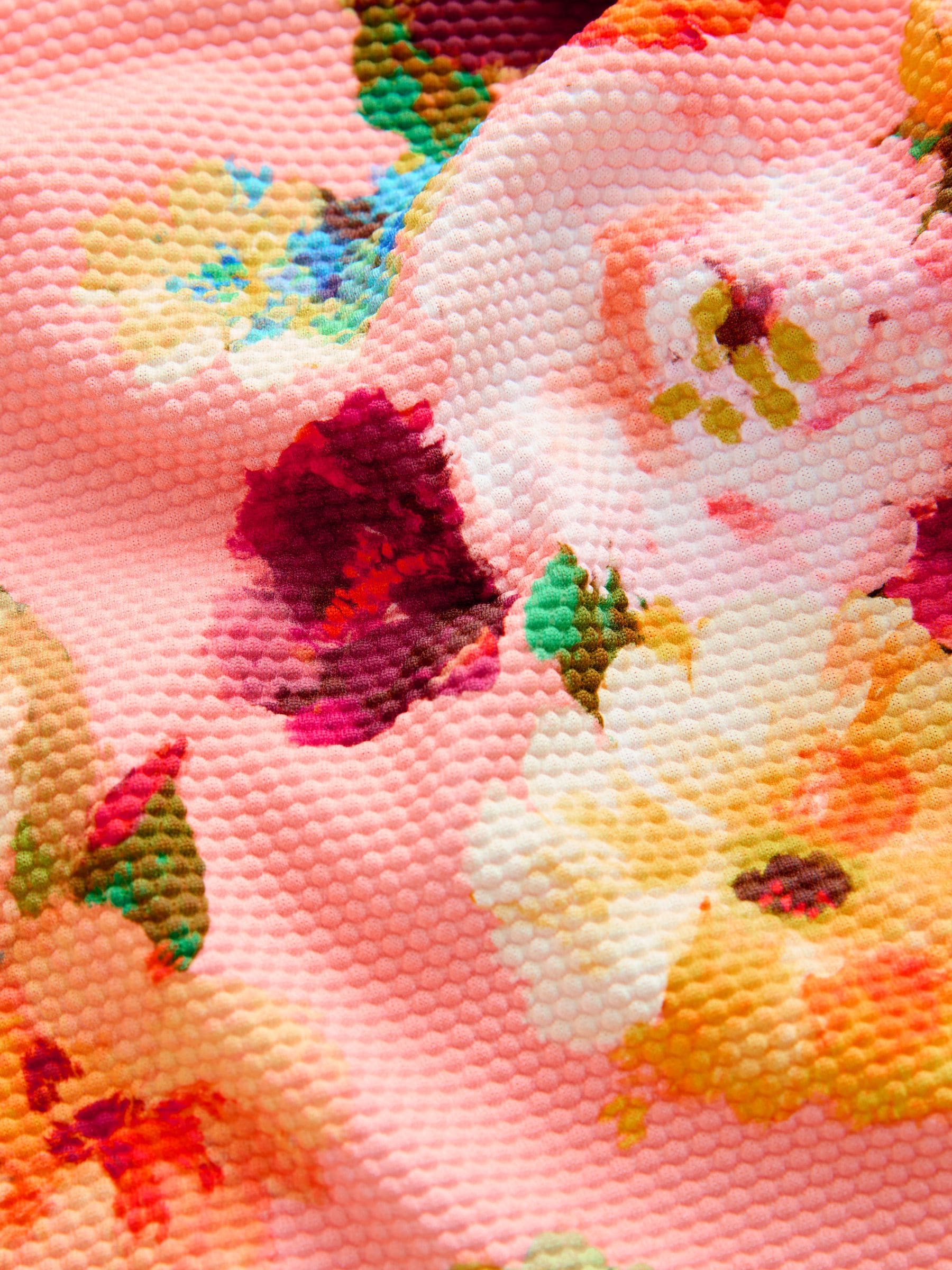 Roze bloemen - Badpak met gesmokte ruchemouwen (3-16jr)