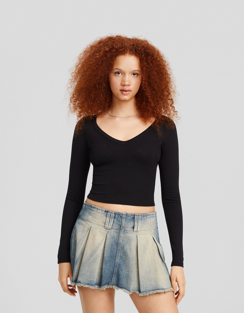 saias-calça plissadas em denim desbotado
