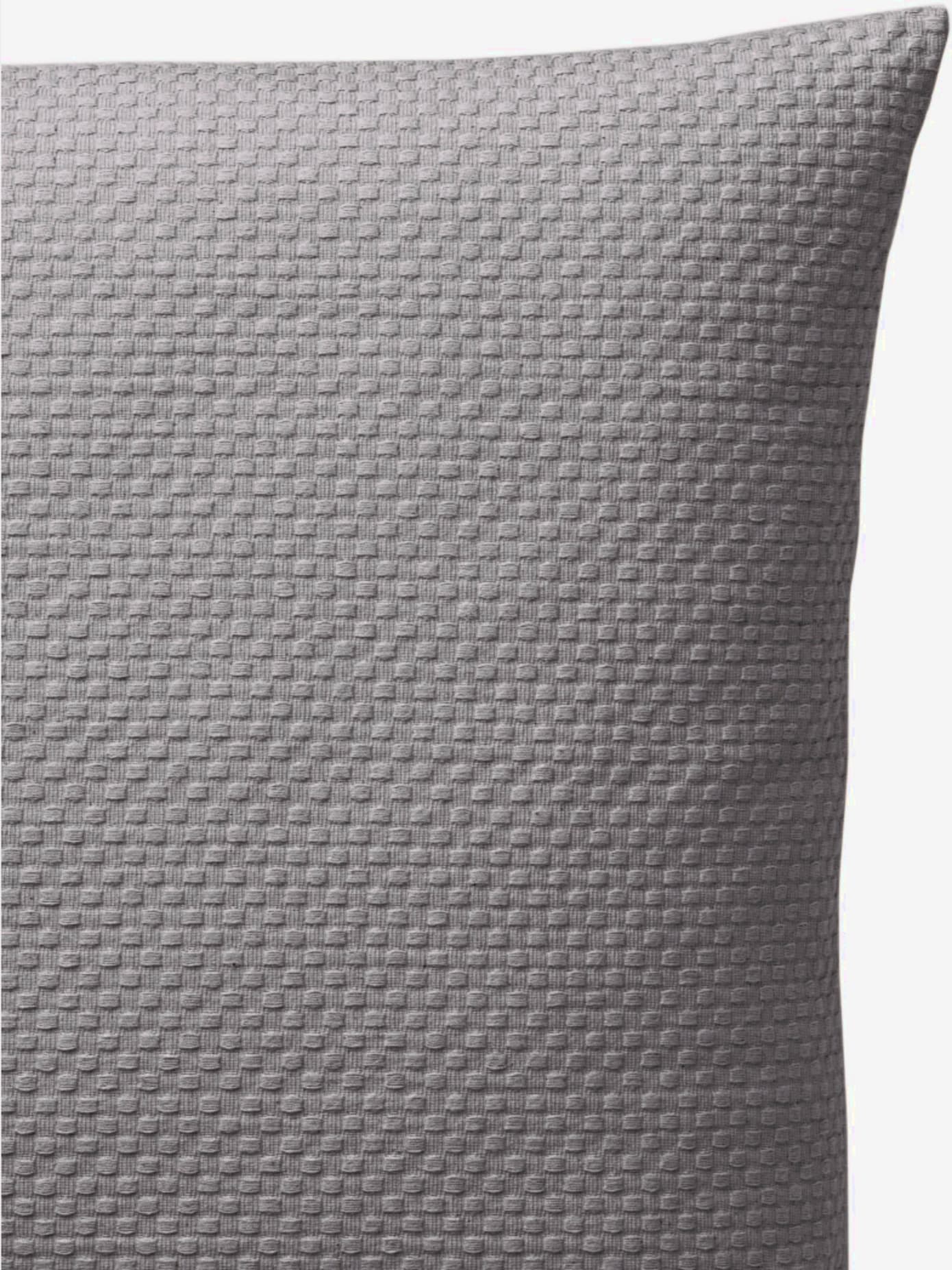 Housse de coussin tissé en relief