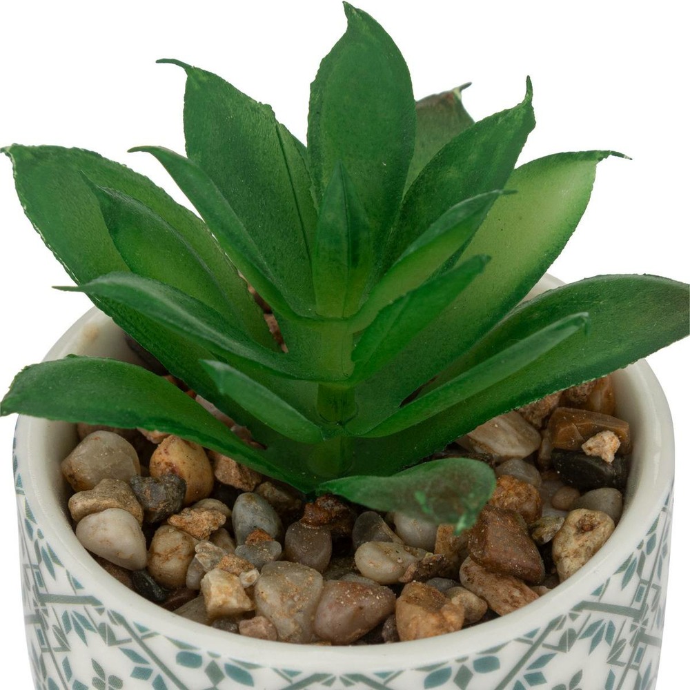 Plante artificielle verte dans un pot en céramique