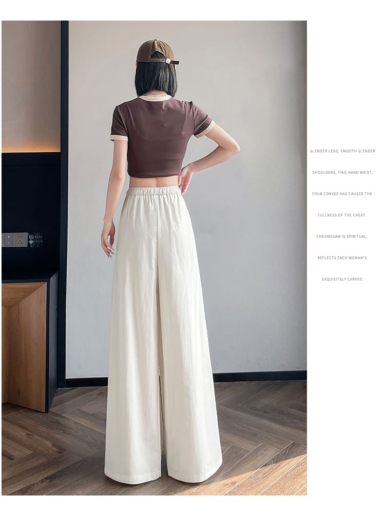 Tel tot 10 - Effen broek met wijde pijpen en trekkoord in de taille (verschillende ontwerpen)