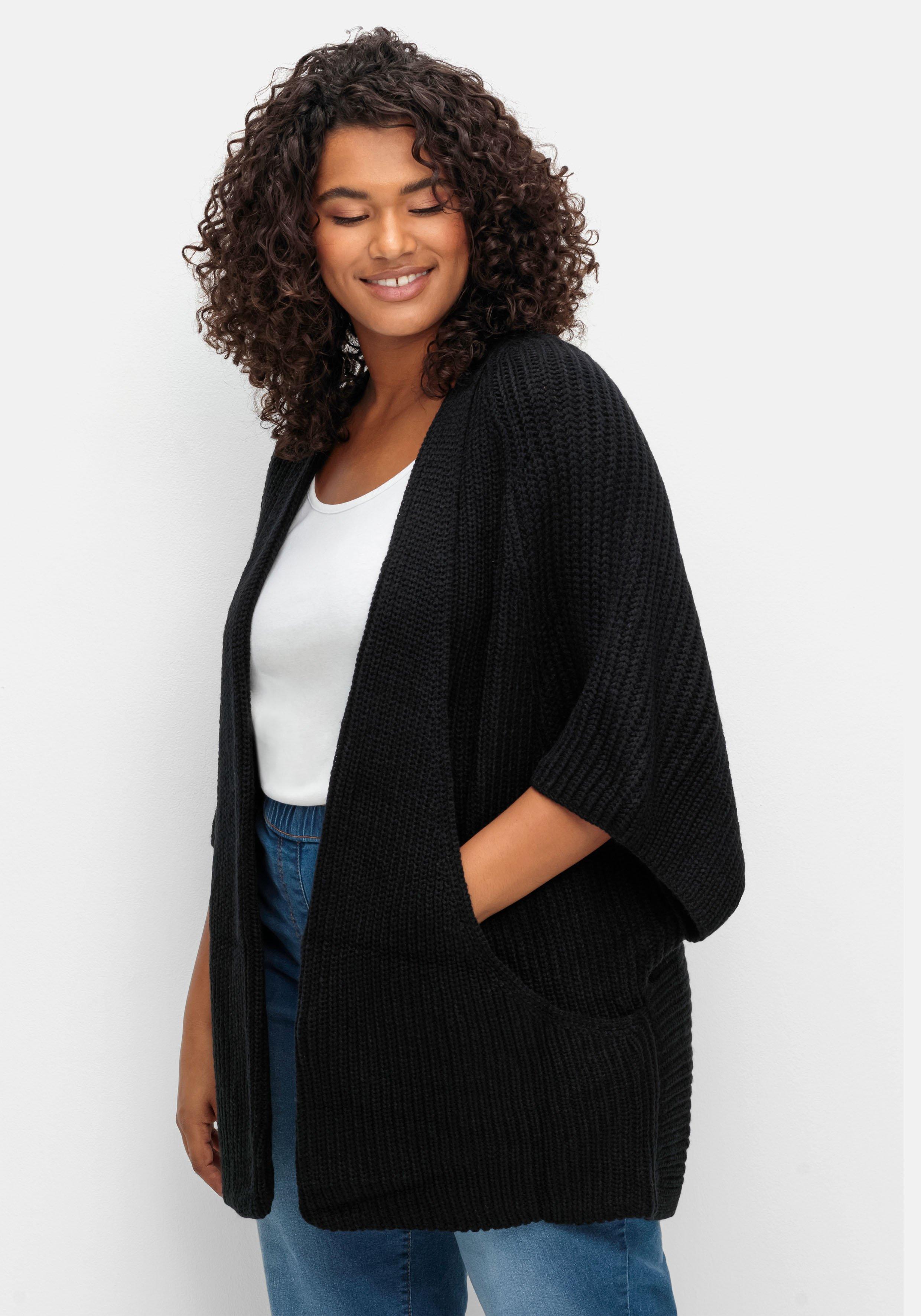 Strickjacke in offener Form, mit verkürztem Ärmel