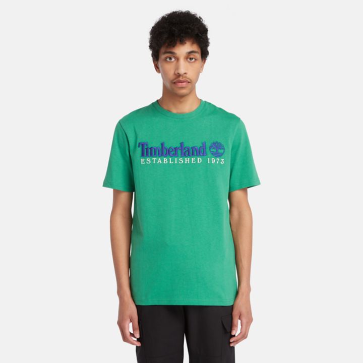 Camiseta masculina verde da equipe Est. 1973.