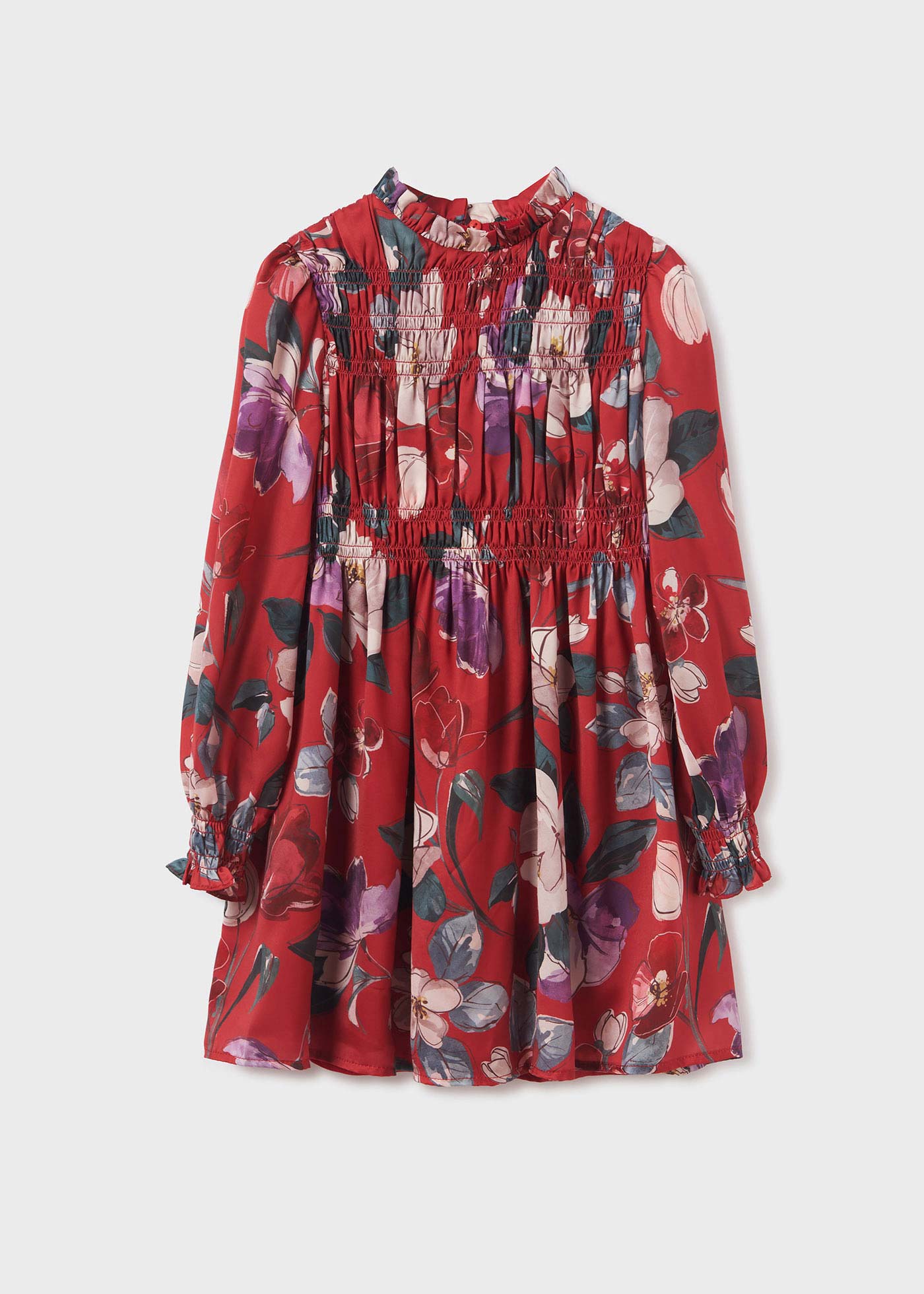 Vestido infantil com estampa de bolinhas e detalhes franzidos.