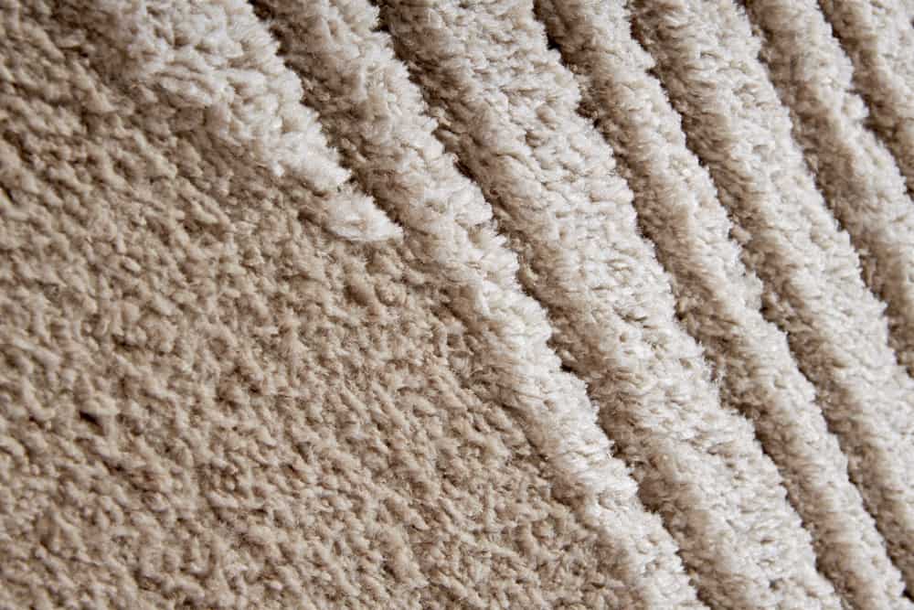 Moderner Hochflor Teppich ELLE DECORATION 235x160cm beige geometrisches Muster