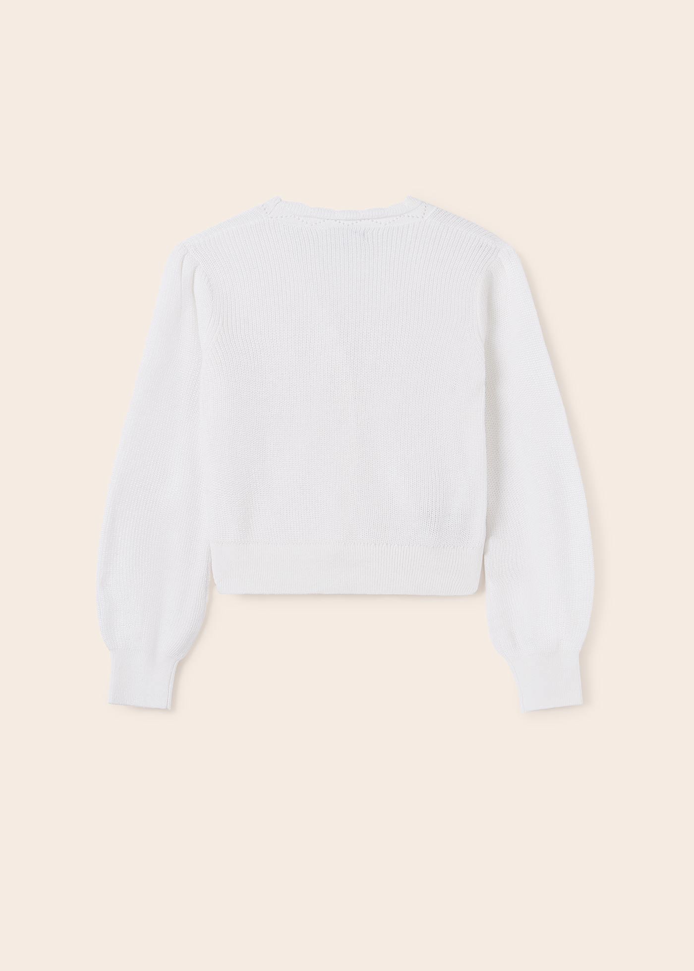 Casaquinho de tricô infantil com mangas bufantes.