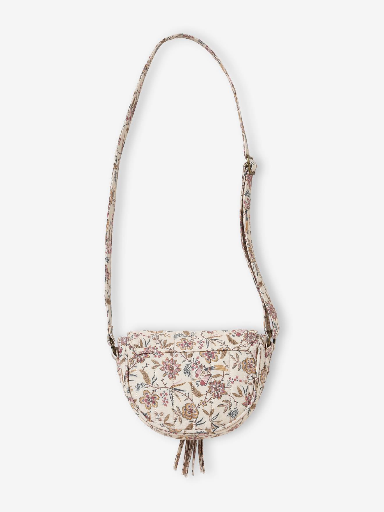 Bolsa feminina bege com estampa floral.