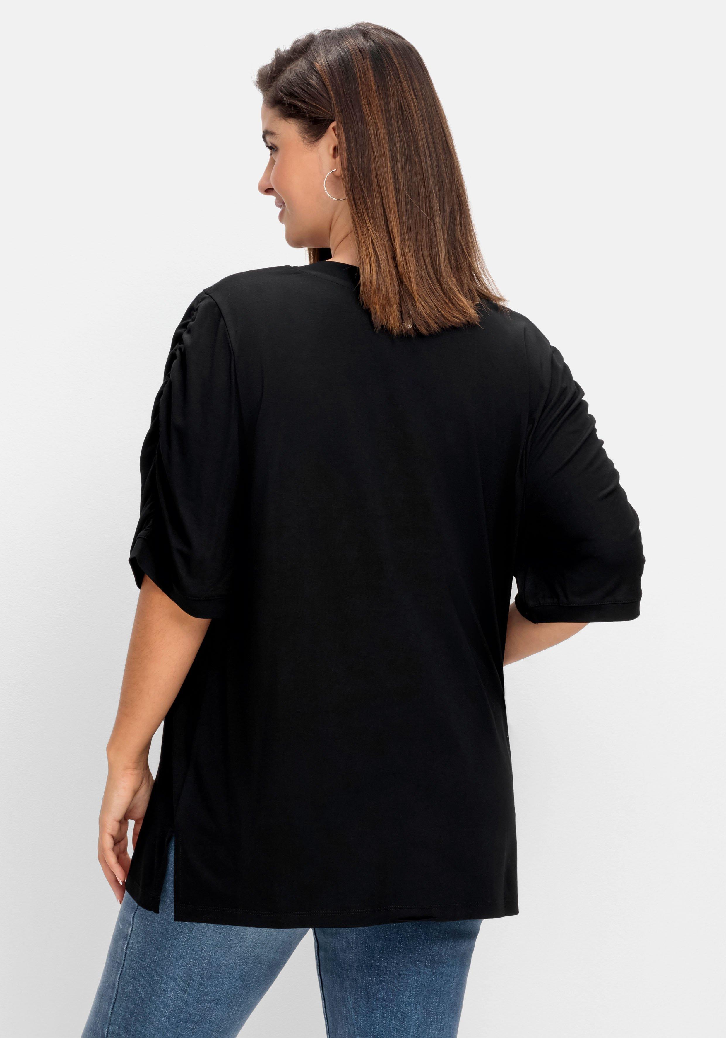 Shirt mit Blütenprint am Saum